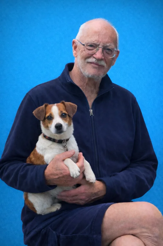Dr John Montgomery holding a Jack Russell puppy
