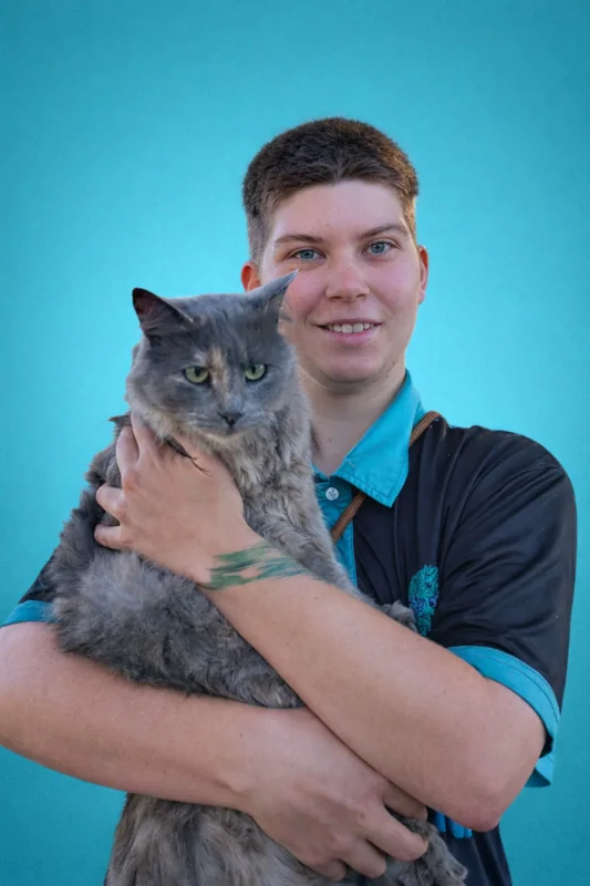 Tayo holding a grey cat